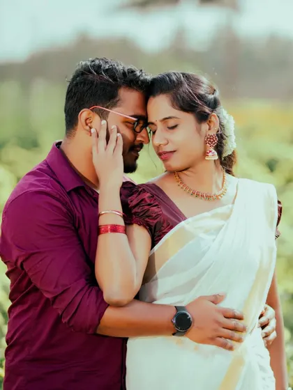 An intimate close-up of a couple sharing a tender moment. Dressed in traditional Kerala attire, this photo highlights the quiet beauty and deep connection we aim to capture in our couple portraits.