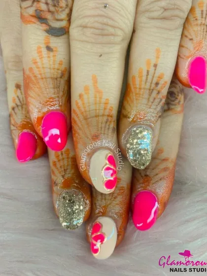 This set is for the bride who loves to be bold. We paired vibrant hot pink nails with dazzling gold glitter accents. The hand-painted 3D hearts and the way the colors pop against the henna make this a truly unforgettable festive look.