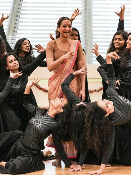 A joyful moment on stage with the cast of 'Sitayana'. Choreographing large groups is about creating a sense of unity and shared energy.