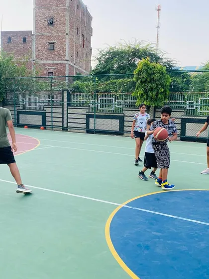 A young player practices his dribbling.
