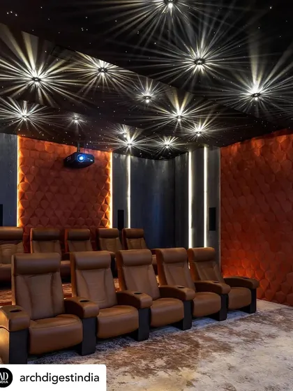 Entertainment zones are about creating an immersive experience. For this private home theatre, we designed a starlit ceiling and used plush, comfortable seating and acoustically treated wall panels to build a luxurious, cinematic escape right at home.