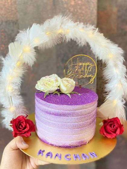 Our purple hoop cake in the daylight, showing off its beautiful ombre and sparkle.