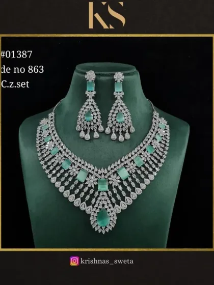 A premium quality C.Z. (Cubic Zirconia) set in a beautiful mint green. The design is delicate and modern, perfect for a cocktail party or festive gathering.