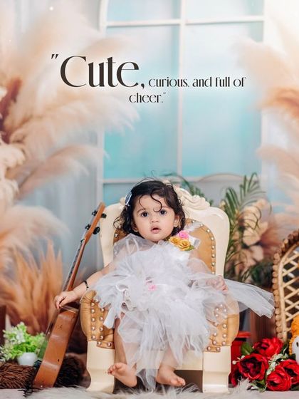 Cute, curious, and full of cheer. This little girl, holding a ukulele, is the star of her boho-themed first birthday studio session.
