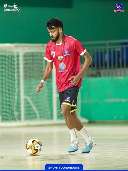A player focused on his ball work during the warm-up.