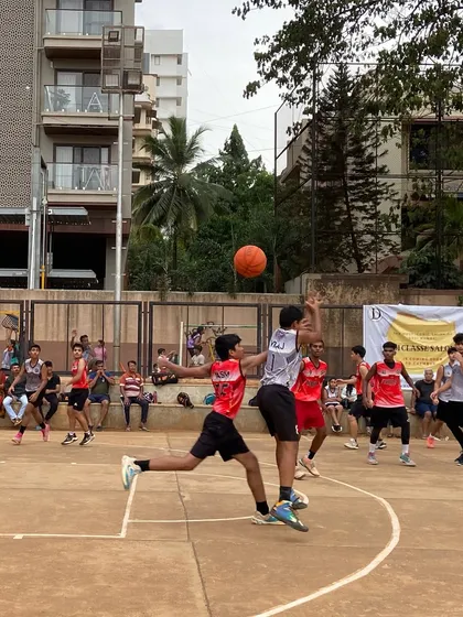 A player goes airborne for a contested layup during the finals. This is the kind of high-flying action you can expect at our tournaments.