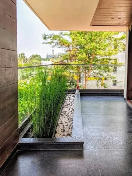 Even a narrow balcony can become a green oasis. For this modern apartment, I used a sleek, built-in planter with tall grasses to add life and a natural screen without sacrificing floor space.