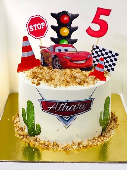 A Lightning McQueen themed cake from the movie Cars, perfect for a 5th birthday.