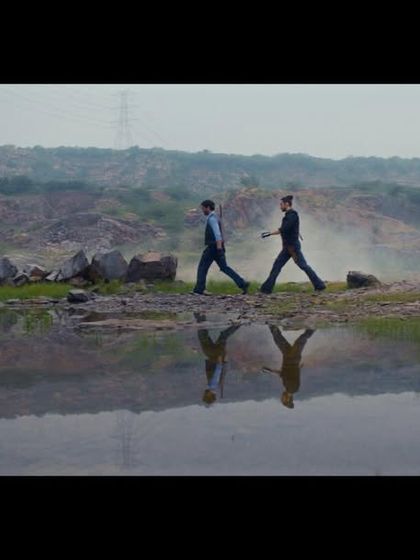 This wide shot showcases the minimalist, modern silhouettes I designed for the characters, set against a dramatic landscape.