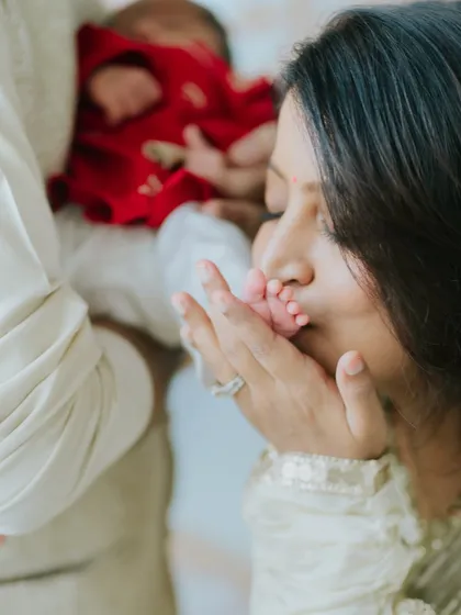 The tiniest feet make the biggest footprints in our hearts. A close-up shot from a newborn family session, focusing on the delicate details and the overwhelming love that a new baby brings.
