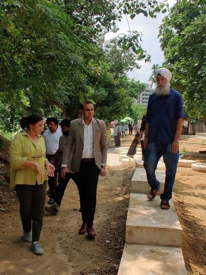 Our team leads partners from Kotak Mahindra Bank on a tour of the newly restored Aravali Creek, showcasing the new pathways and the thriving green environment.