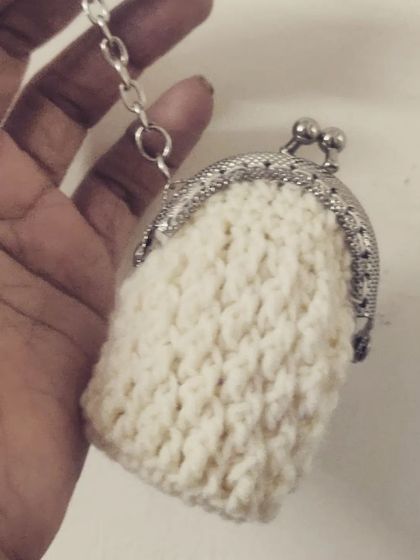 My little crochet experiment turned into this adorable vintage-style coin pouch with a metal clasp. It's timeless, chic, and perfect for keeping your change organized.