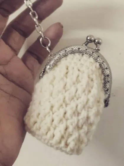 My little crochet experiment turned into this adorable vintage-style coin pouch with a metal clasp. It's timeless, chic, and perfect for keeping your change organized.