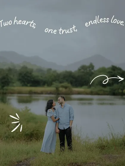 "Two hearts, one trust, endless love." A simple, sweet portrait of the couple by a serene lake, with handwritten text adding a personal touch.