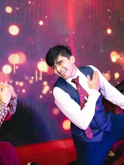 The result of a successful family performance is pure joy. These photos capture the happy, candid moments of a family celebrating together on stage after their dance.