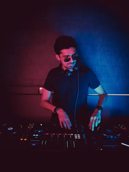 In the zone under the red and blue lights. This is my element, where I can fully focus on the music and the energy of the room.