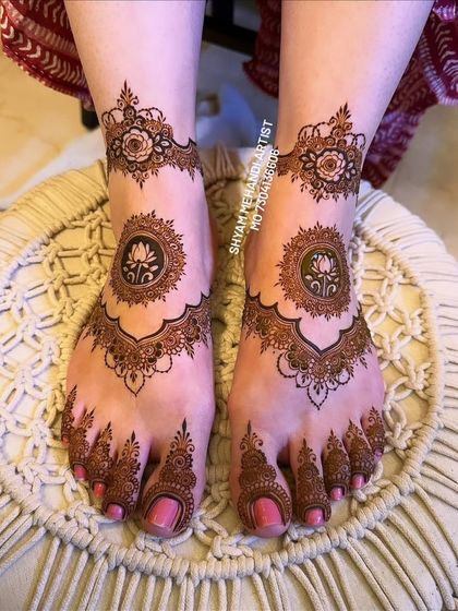 The completed lotus mandala design with a rich, dark henna stain, ready for a special occasion.