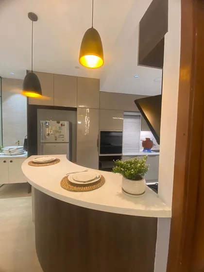 I design kitchens that are the heart of the home. This space features a modern breakfast bar, sleek cabinetry, and pendant lighting, combining functionality with high-end aesthetics.