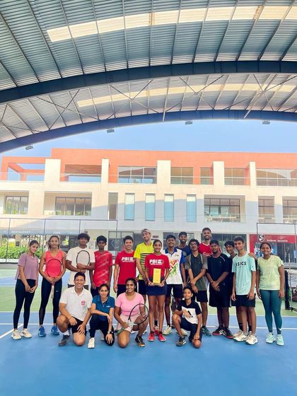 Another shot of our team celebrating a player's hard-earned title, showcasing the vibrant and encouraging atmosphere at our academy.