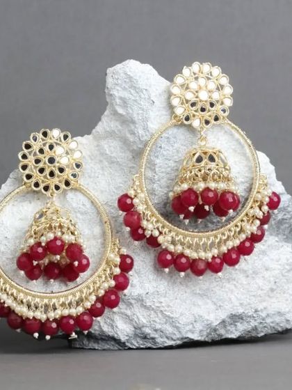 A rich maroon version of our mirror work chandbali hoops. This color is perfect for bridal wear or any grand celebration.