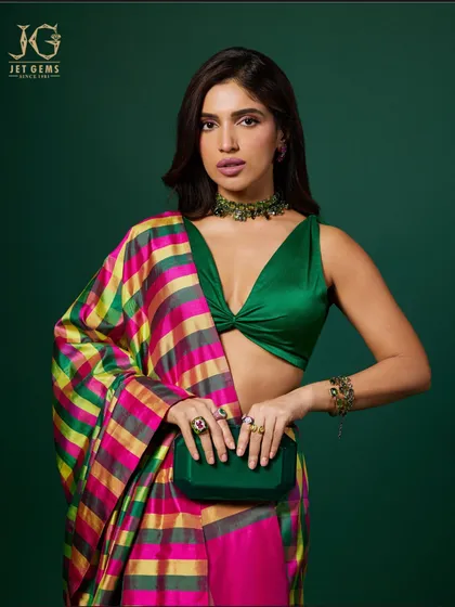 Bhumi Pednekar's full look, where the colourful checked sari is beautifully grounded by the deep green of her blouse, clutch, and my custom emerald choker necklace.