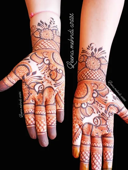 A beautiful Arabic-style guest mehndi with floral and paisley elements. The design flows diagonally across the hands, creating an elegant and modern look.