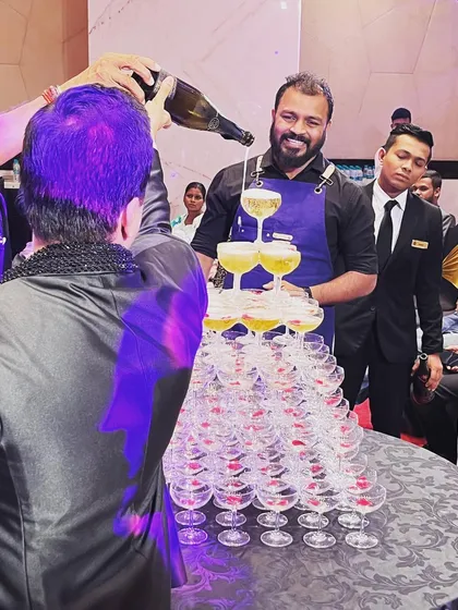 The Champagne tower is a classic centerpiece for any grand celebration. We love building these impressive structures for anniversaries and weddings, creating a perfect photo opportunity and a moment of pure elegance.