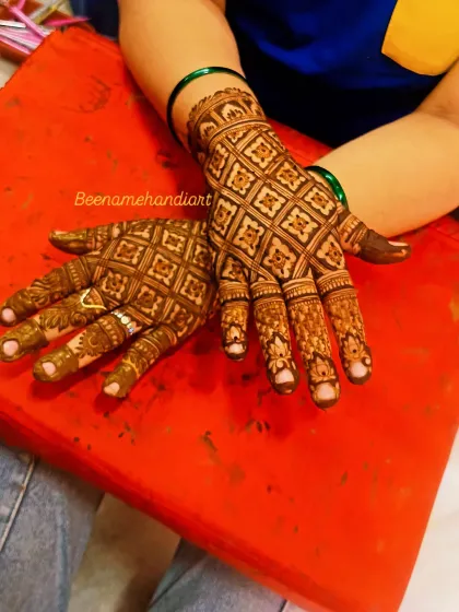 A full-hand jaali (net) pattern mehandi, perfect for Teej or any festival. This classic design is always elegant and looks very rich.