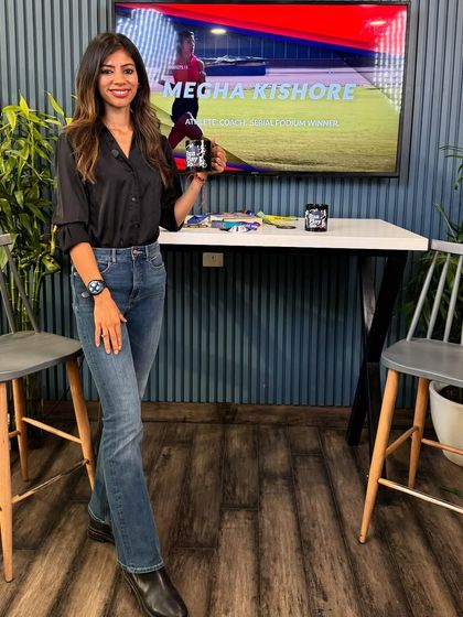 In my casual clothes, holding a mug with my picture on it. This represents the journey from IT girl to marathon coach, a passion turned into a profession.