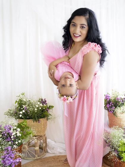 A fun, playful shot with the mother holding her daughter upside down. These are the moments of pure joy.