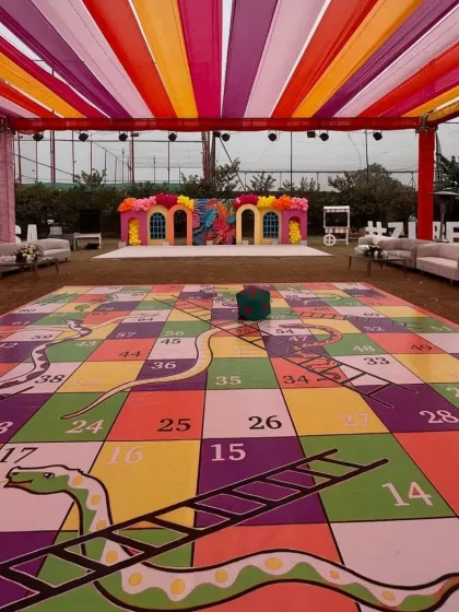 Our giant game rentals are perfect for getting everyone involved, from kids to adults. This oversized Snakes and Ladders board was a huge hit at a pre-wedding game night, providing hours of interactive fun for all the guests.
