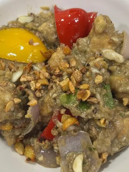A close-up of our popular Fish Butter Garlic starter. Tender pieces of fish are cooked in a creamy, garlicky sauce with bell peppers, offering a perfect balance of flavours.