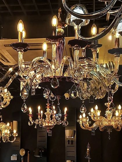 An ornate, multi-armed chandelier that blends classic design with modern elegance.