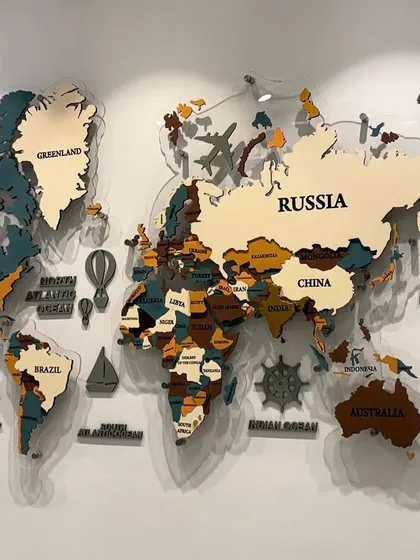 A clear shot of the world map without the backlight, showing the details of the multi-colored, layered MDF and acrylic country cutouts.