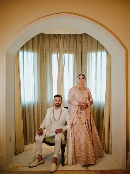 This shot is all about regal elegance. The couple is framed by the archway, creating a formal portrait that feels like a painting. I focus on composition and posing to create powerful, sophisticated images like this one.
