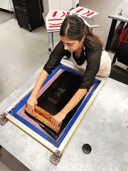 Me in the print shop, screen printing one of the color layers for the Violet Chachki poster.