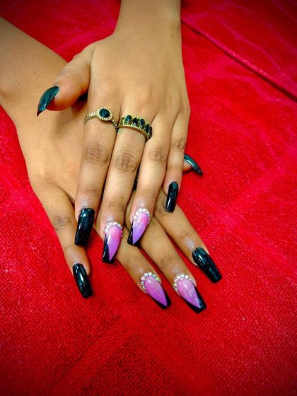 Another view of the black and pink V-French design, showing off the long, elegant shape and the sparkle of the rhinestones.