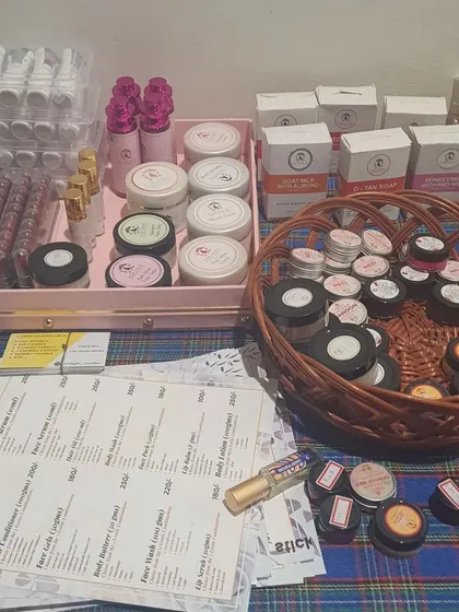 A behind-the-scenes look at our stall from a recent event. You can see our range of handmade cosmetics, soaps, and lip balms ready for customers.