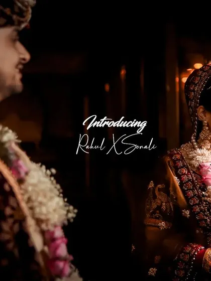 A candid shot capturing the bride's shy smile as the groom looks on during their wedding ceremony.