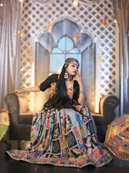 A regal pose from my 'Halo re Halo' Navratri shoot. The vibrant, printed lehenga and traditional jewelry create a stunning visual.