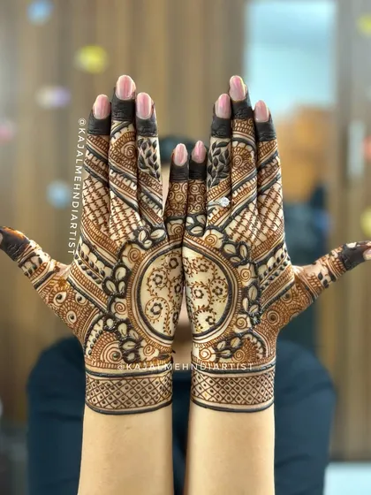 A fusion design for the back of the hand, blending a traditional mandala with modern floral patterns.