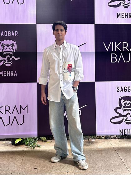 Sam Kothi adds a touch of elegance in the ethereal Elysian Set. The light pink cotton shirt, adorned with a holographic patch, embodies effortless style.