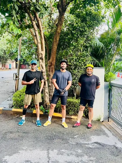 The cycling trio taking a break under the shade of a tree. Our rides always include moments to rest, hydrate, and chat.