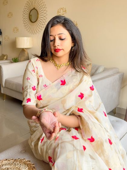 A close-up of my hands, showing the delicate pearl bracelet I paired with the look. It’s the small details that bring a whole outfit together.