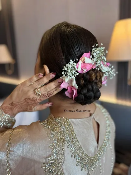 Another view of this beautiful floral bun. It's a perfect hairstyle for a summer wedding.