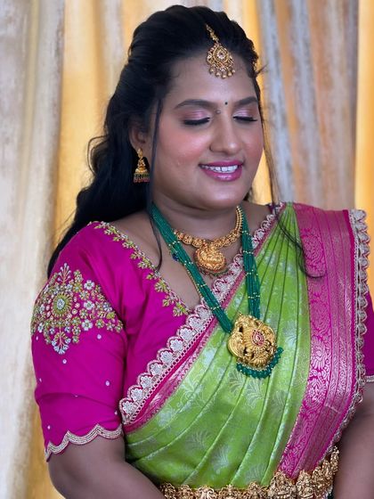 A close-up of Deepika's makeup, featuring soft pink eyeshadow and a happy smile.