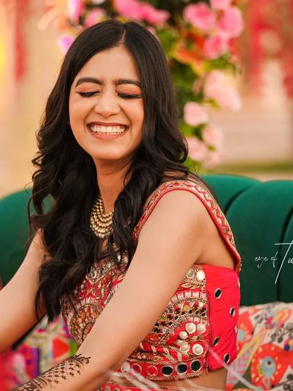 A candid shot of the bride's unrestrained laughter during her Mehendi ceremony. It's my job to be ready for these fleeting moments of pure happiness.