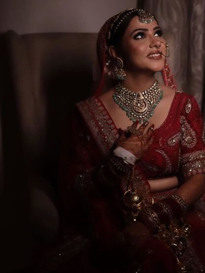 A dreamy, candid shot of my bride looking up with a happy smile. The soft lighting makes her glow.
