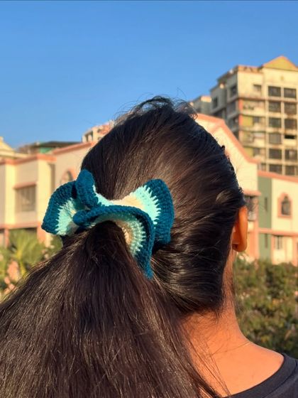 A simple way to elevate your ponytail. This is my two-toned blue crochet scrunchie, adding a pop of color and texture to your hair.