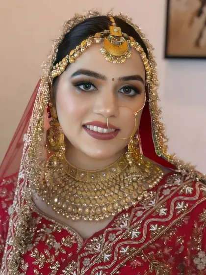 A happy bride with a bright smile. Her makeup is fresh and clean, with a focus on glowing skin and a warm, inviting expression.